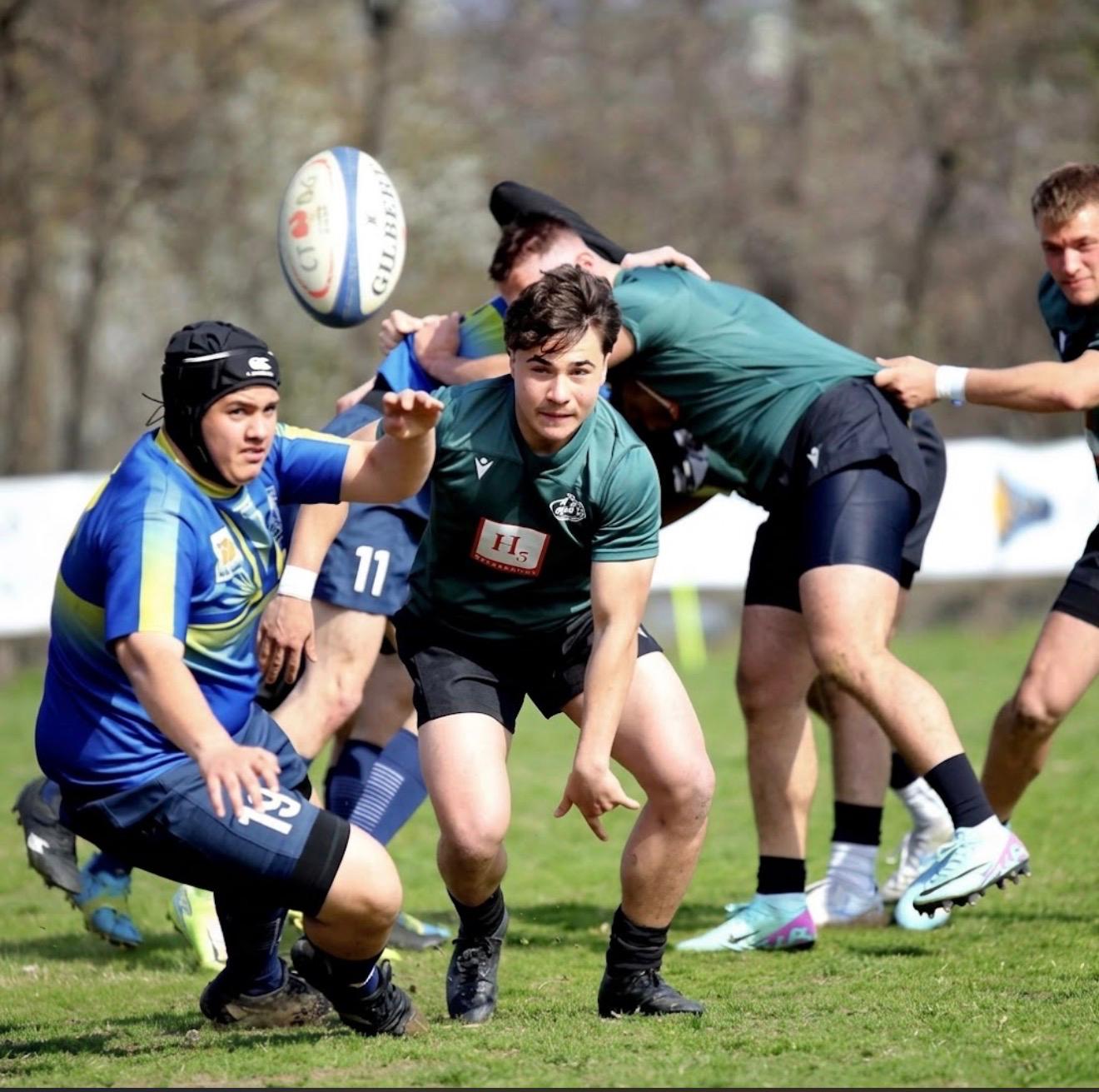 Rugby players contesting the ball